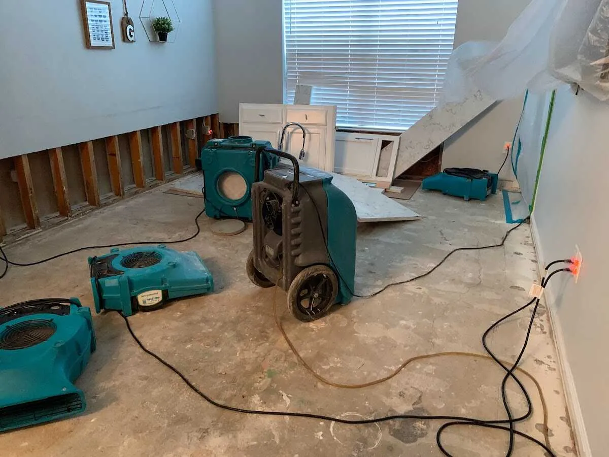 Dehumidifier in flood-cut room for Water Damage Restoration in Hewitt